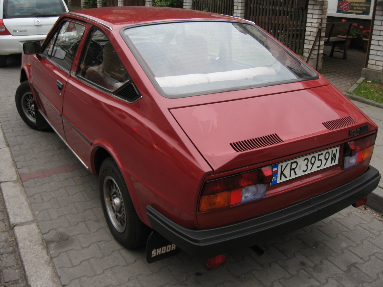 Rear hatchback view with classic vent and taillight design