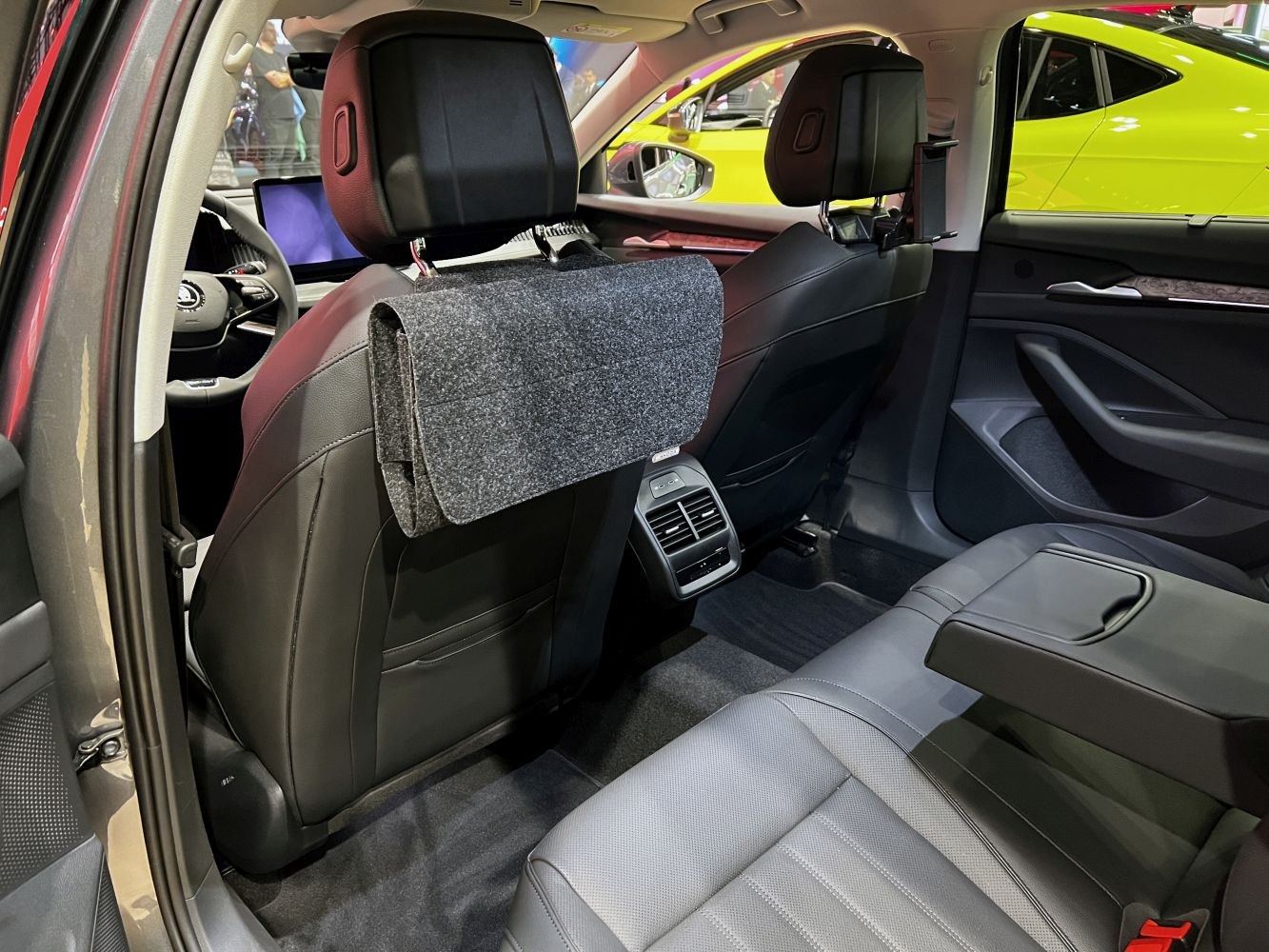 Rear interior with black leather seats and tablet holder