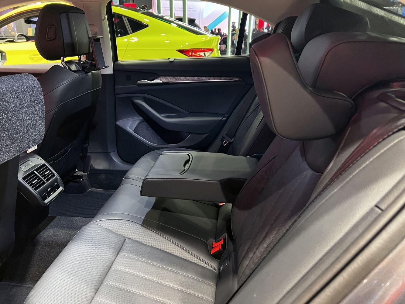Rear car seat with armrest and premium upholstery