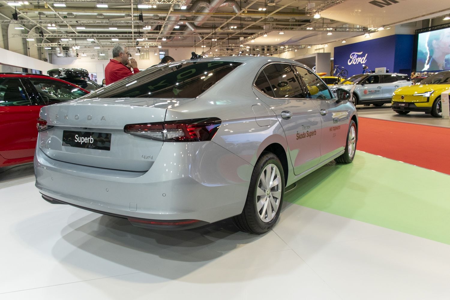 Rear view of a modern sedan with LED tail lights and 4x4 badge