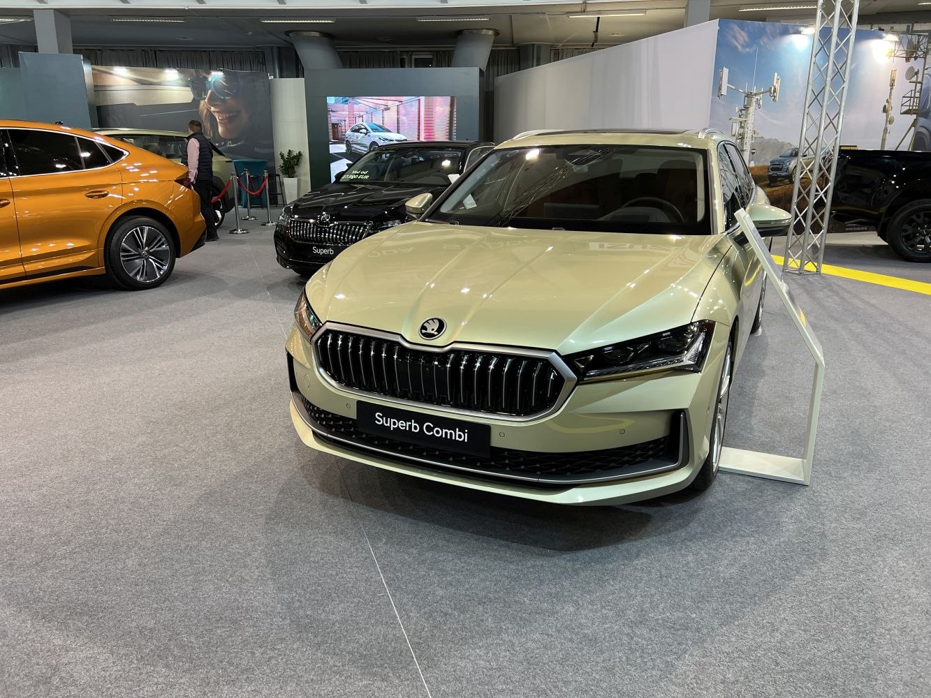 Modern front grille with sharp LED headlights on a sleek station wagon.