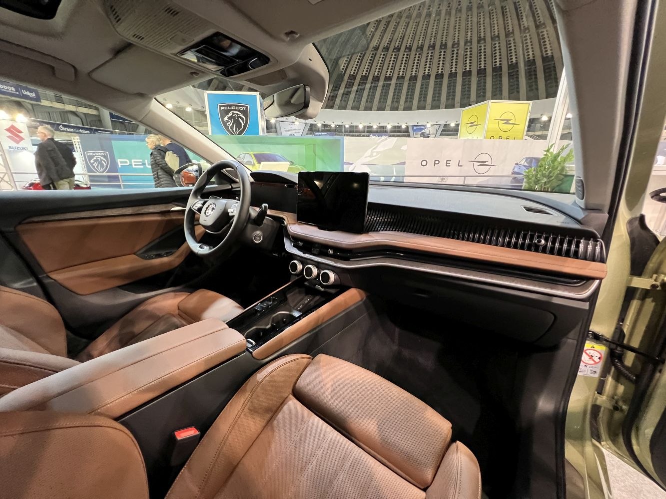 Modern dashboard with touchscreen and brown leather seats