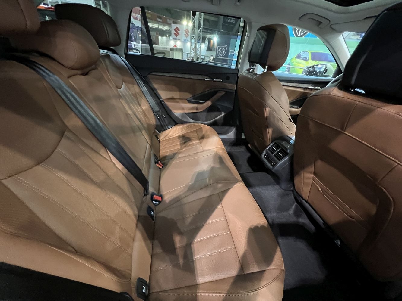 Rear brown leather seats and spacious interior with rear air vents