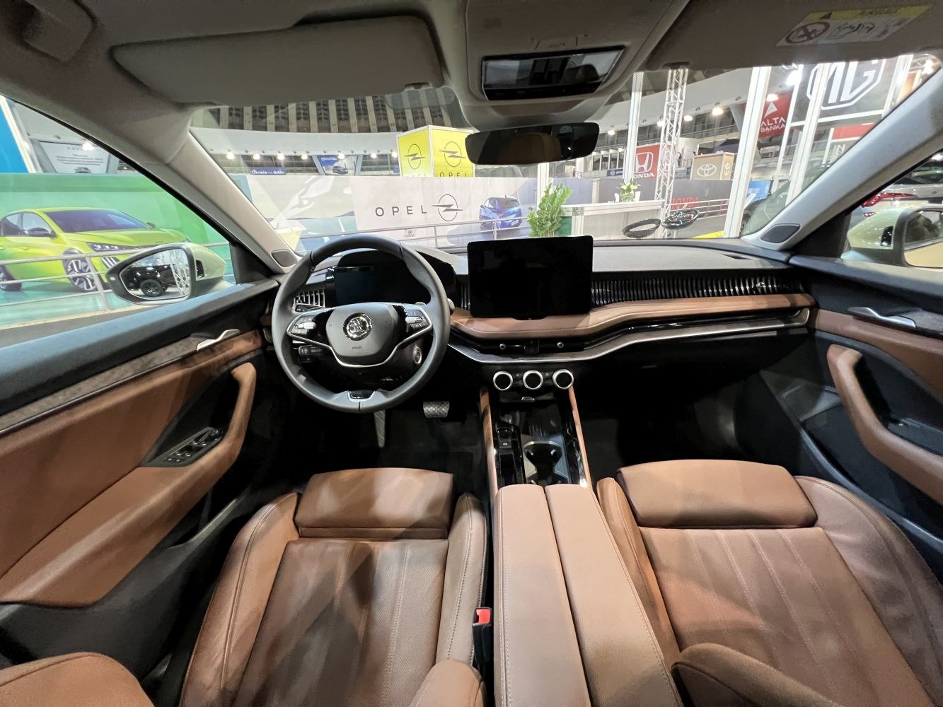 Modern car interior with digital display and brown leather seats