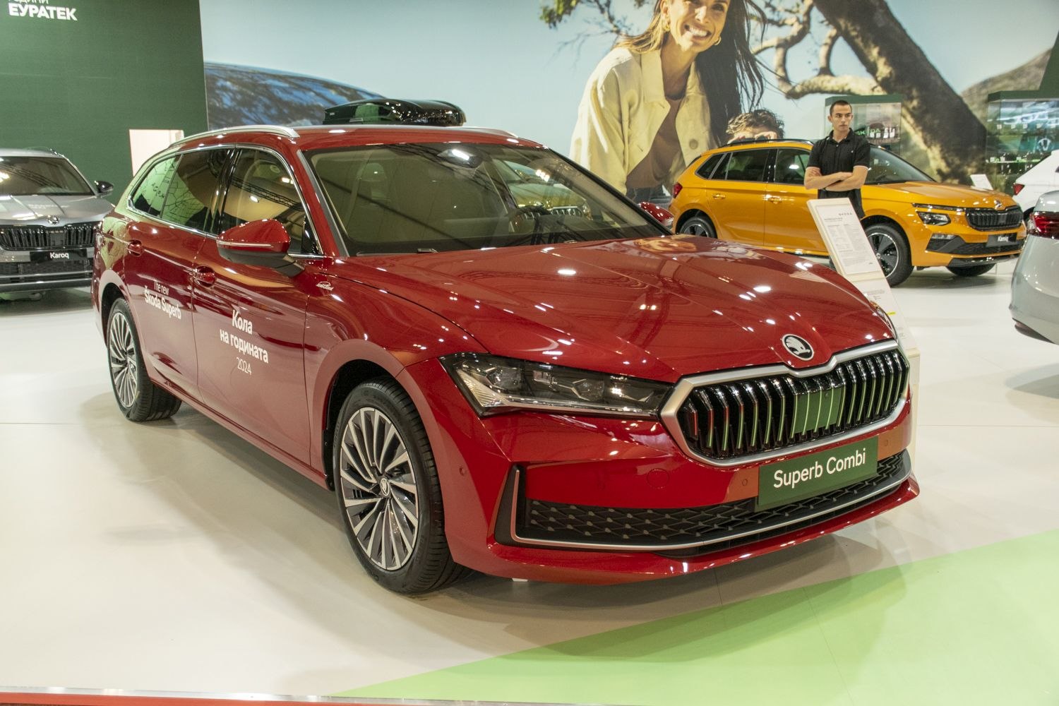 Red modern station wagon with bold front grille and sleek headlights