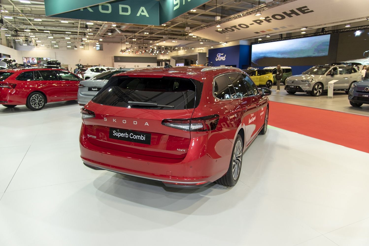Rear view of red station wagon with sleek taillights and 4x4 badge