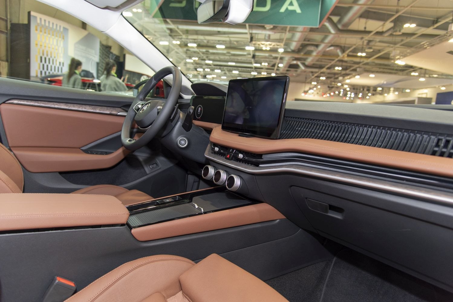 Large touchscreen infotainment and tan leather interior