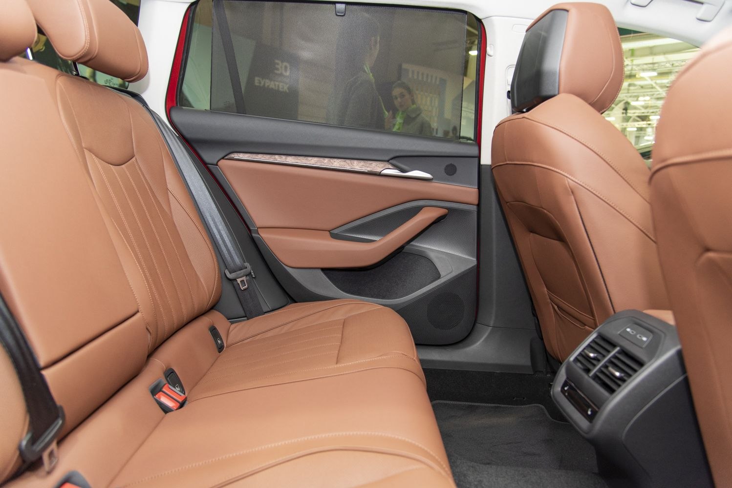 Brown leather rear seats with rear door and ventilation unit