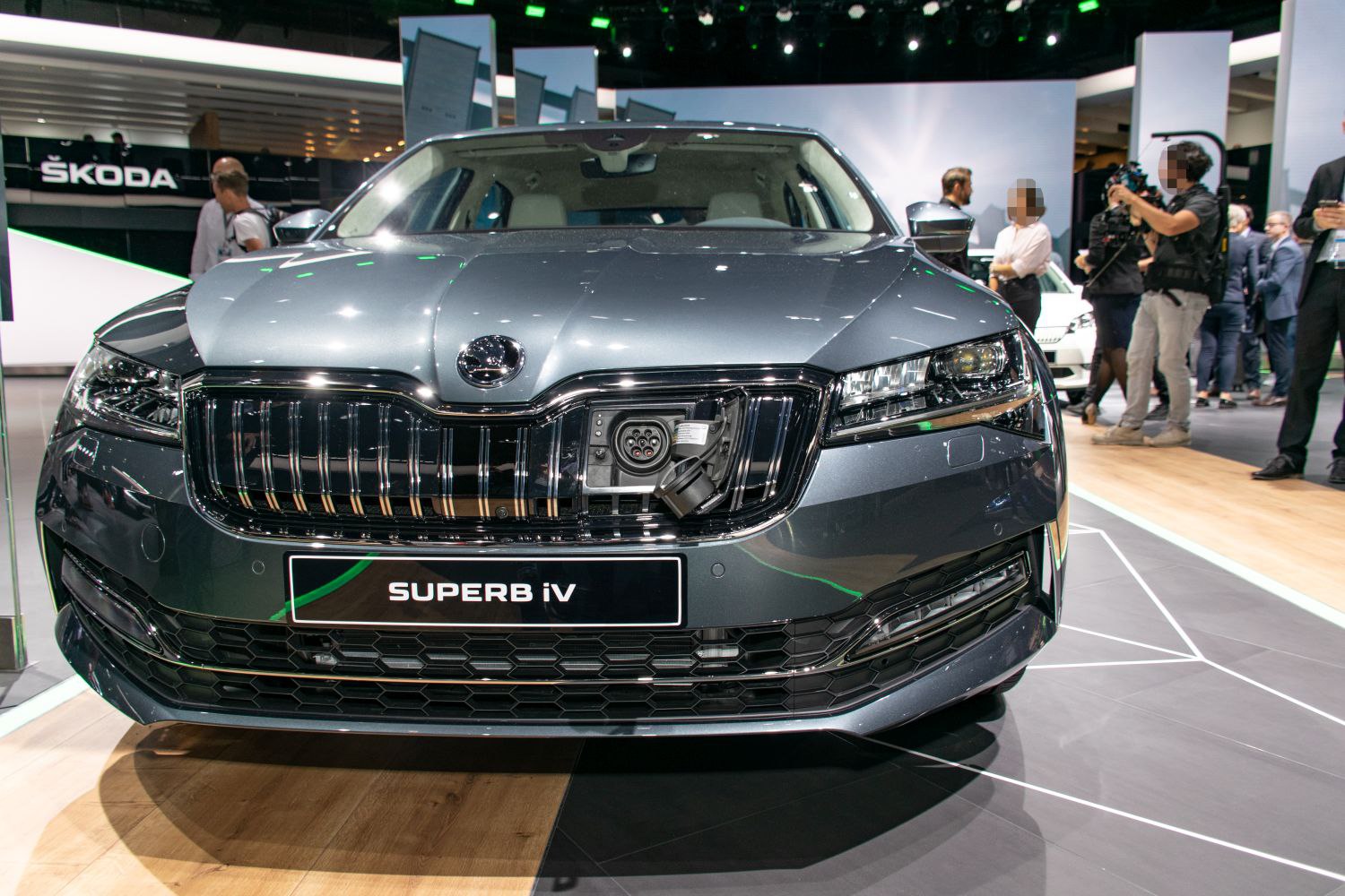 Front grille with electric charging port in luxury sedan