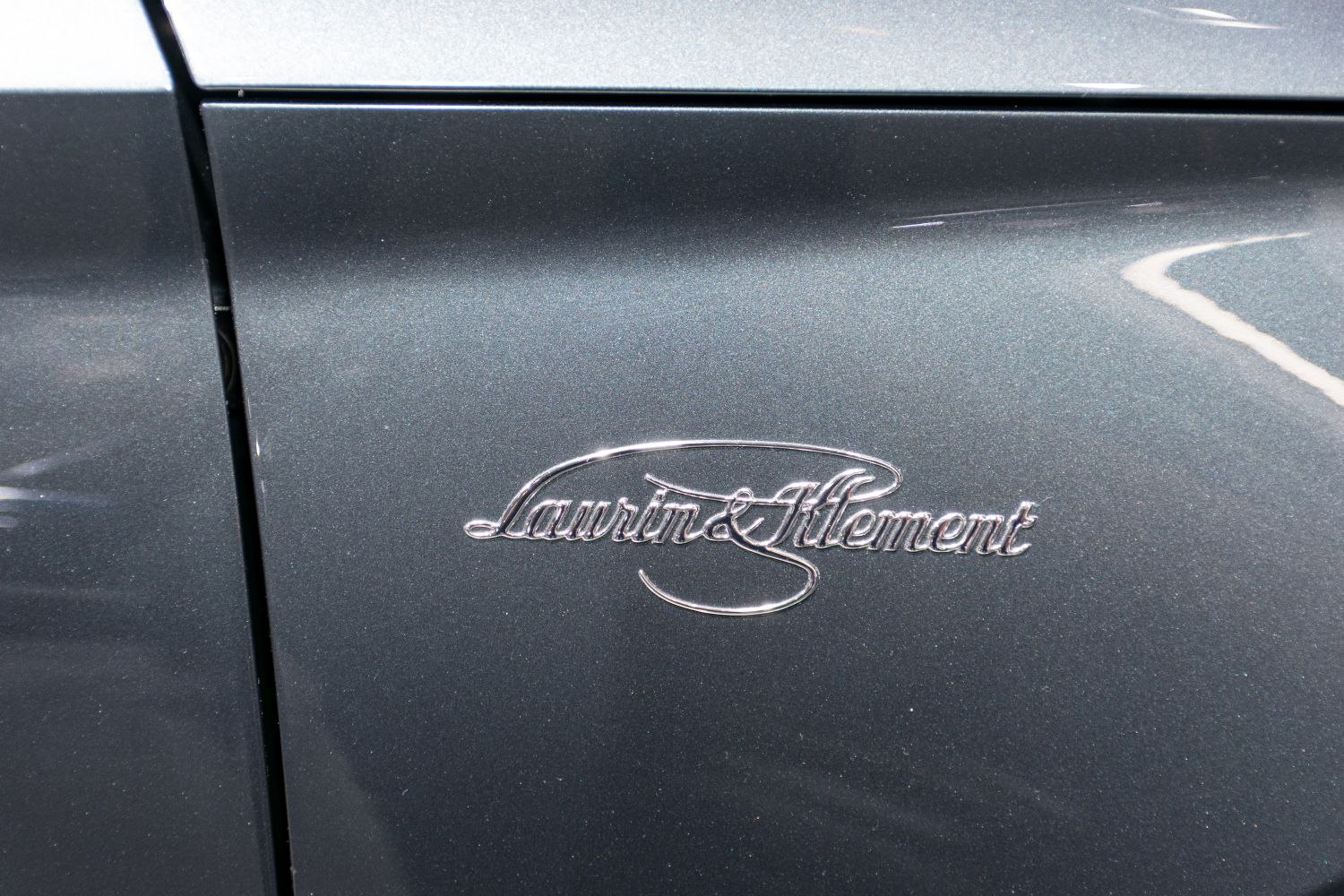 Close-up of Laurin & Klement luxury badge on car door