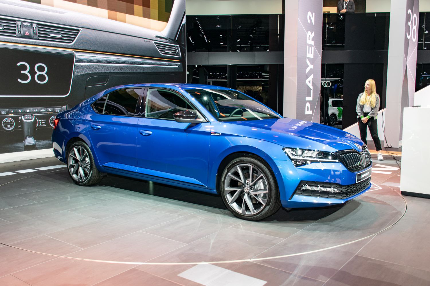 Blue sedan with LED headlights and multi-spoke alloy wheels