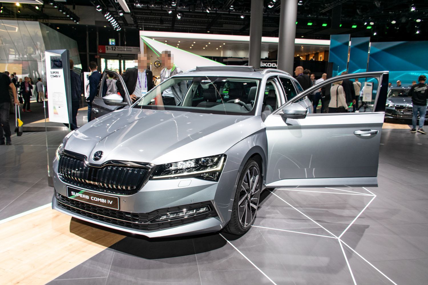 Front angle view with open passenger door and LED headlights.