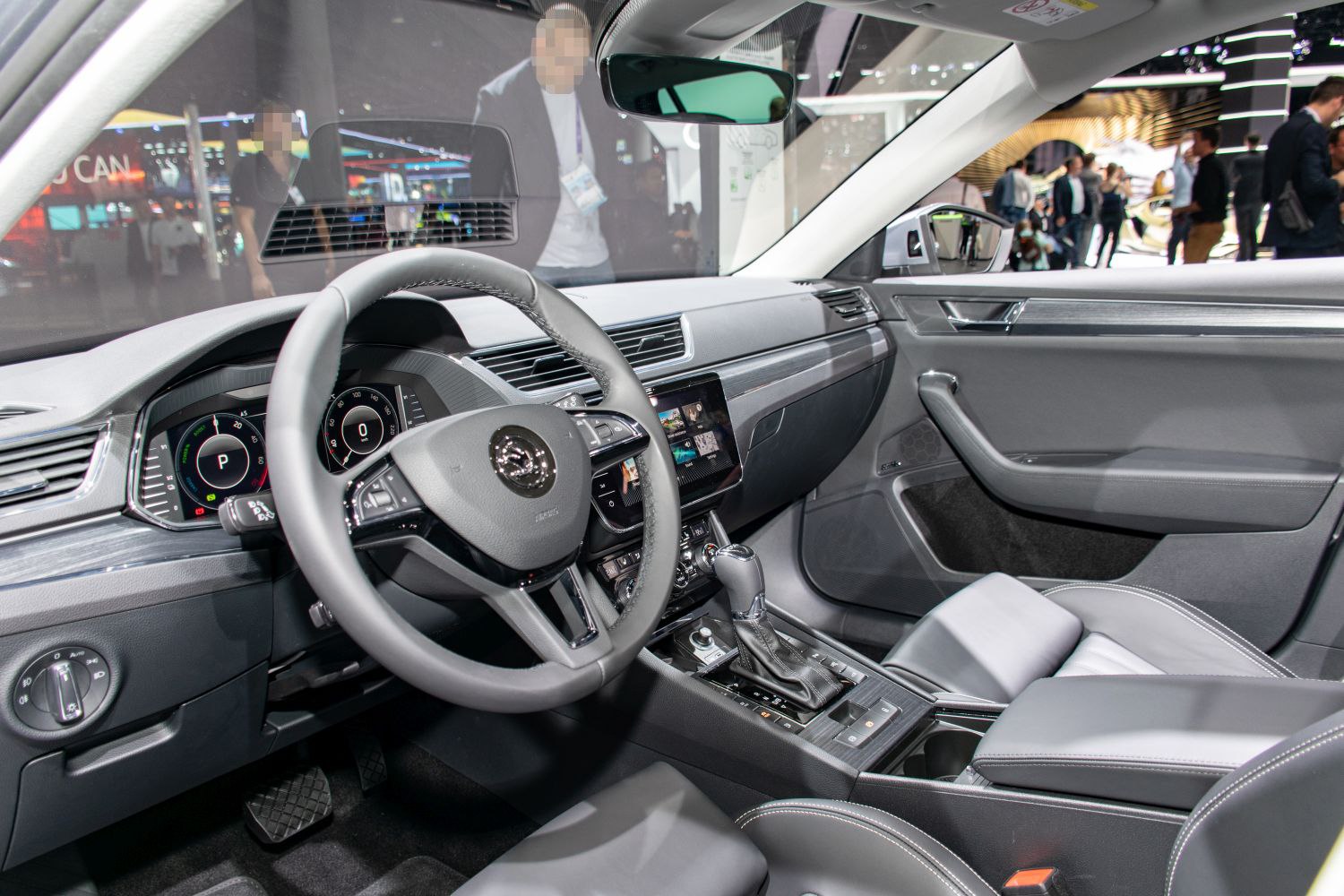 Modern car interior with digital instrument cluster and multifunction steering wheel