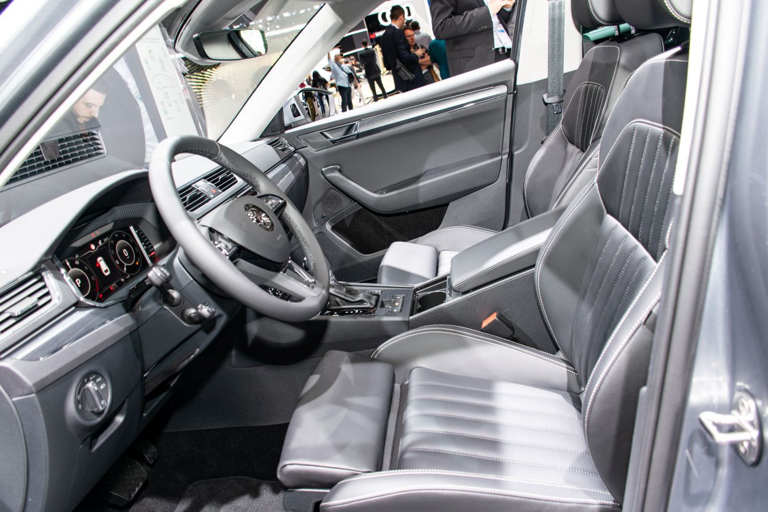 Modern car interior with leather seats and digital dashboard display