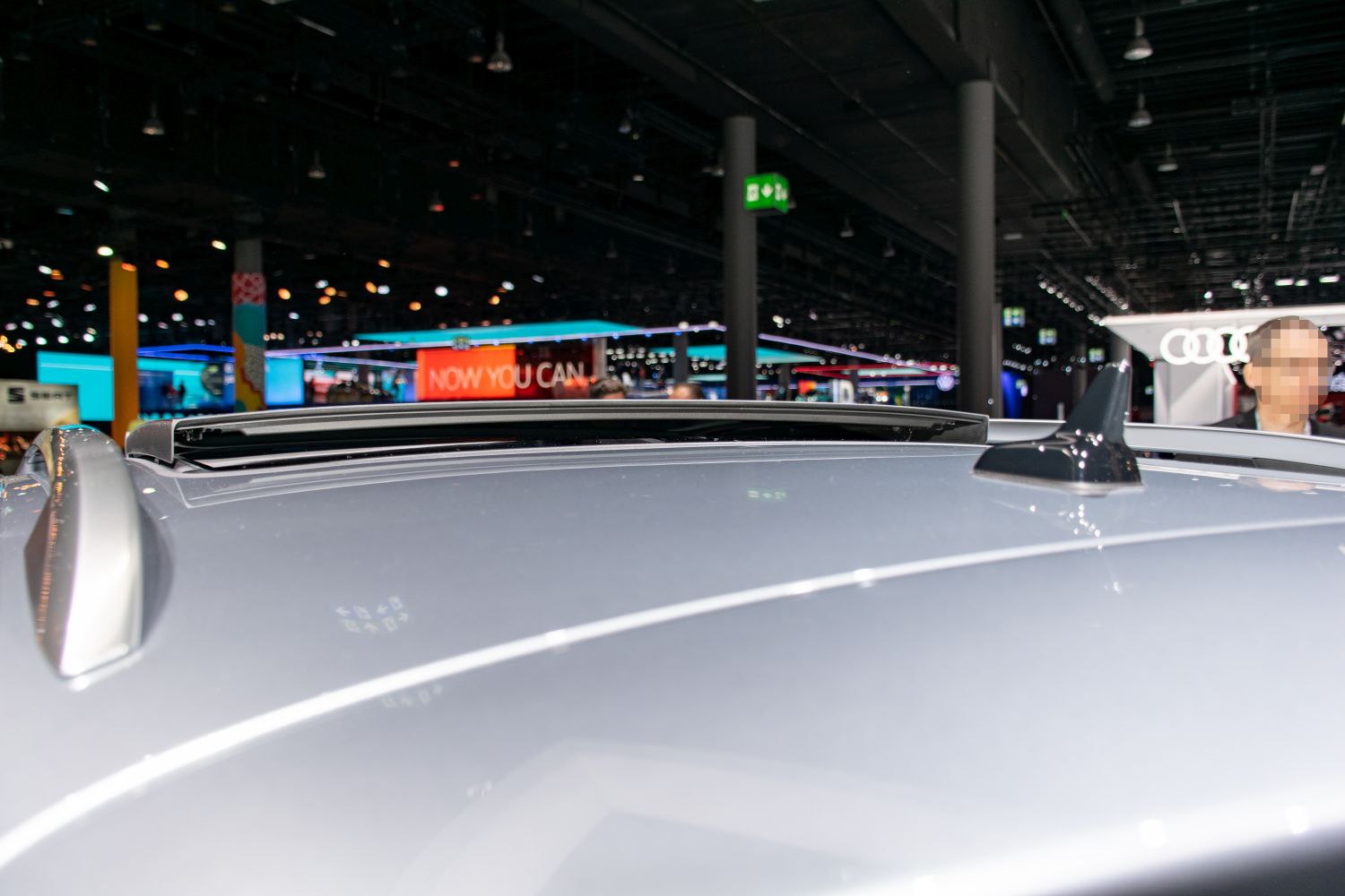 Roof with roof rails, sunroof open, and shark fin antenna