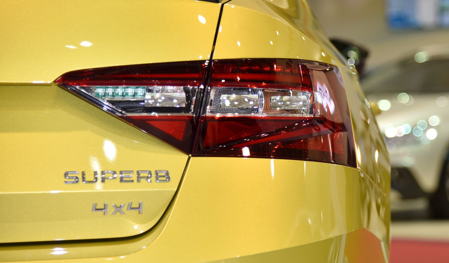 Car rear tail light and 4x4 badge on yellow body