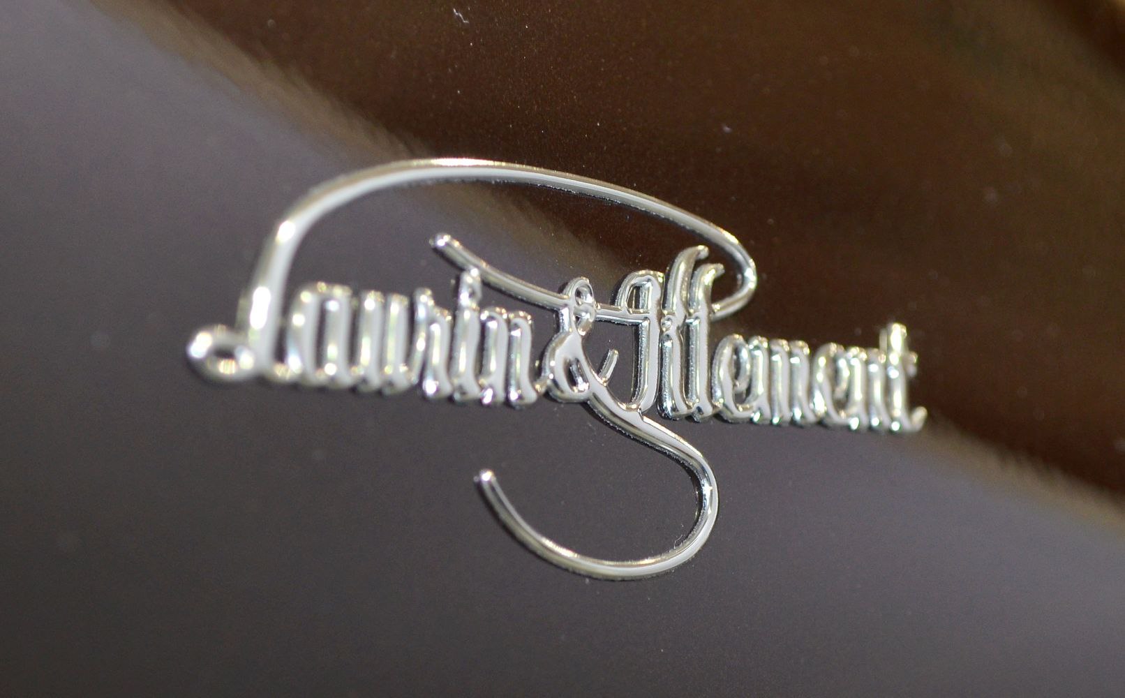 Close-up of chrome Launch & Elegant badge emblem