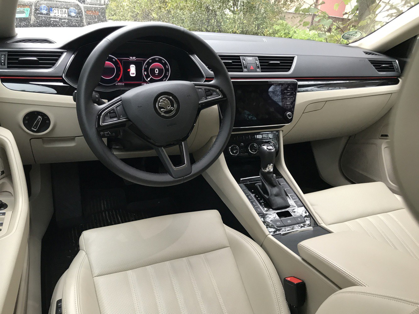 Digital dashboard and center console with beige leather seats