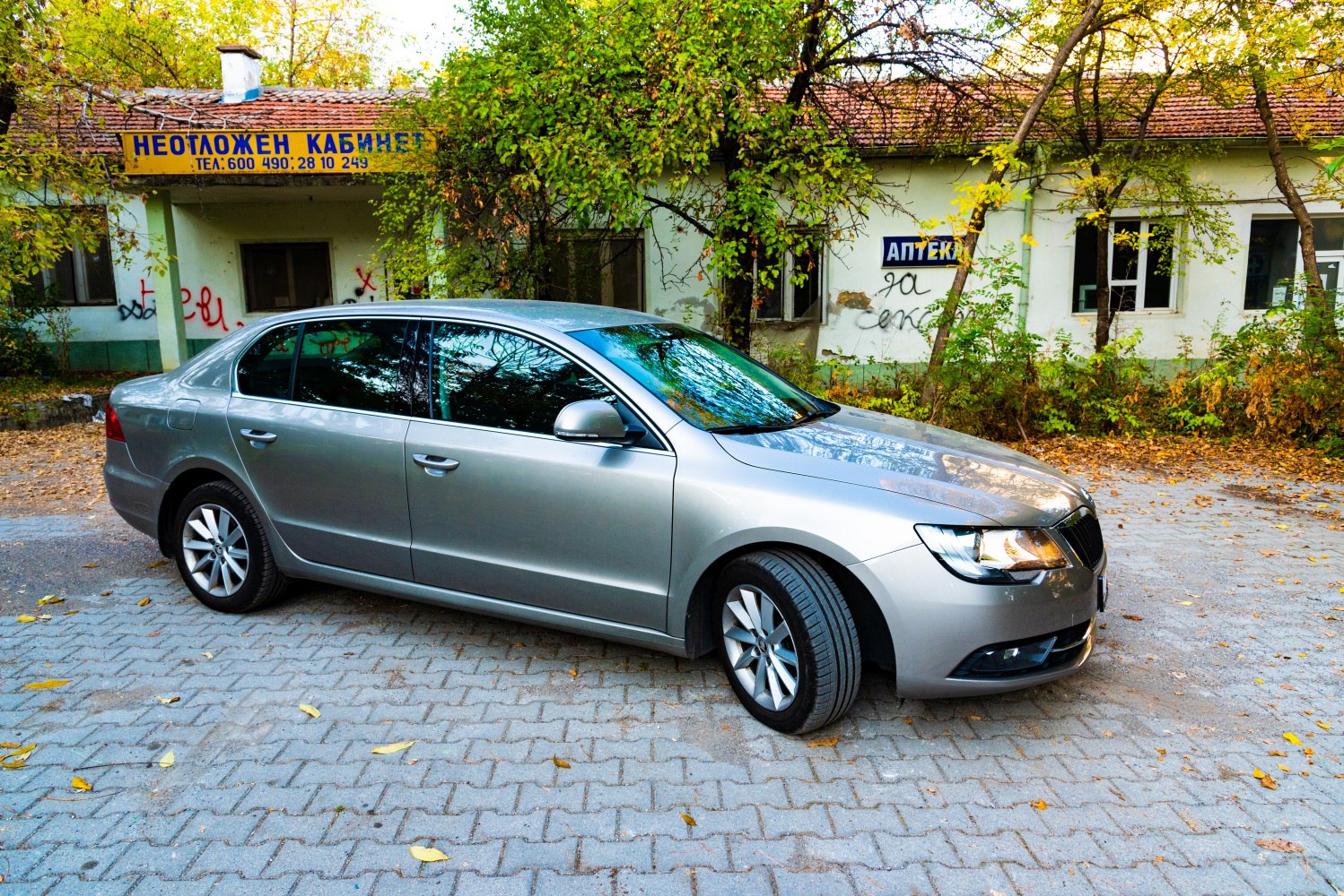 Silver large sedan with modern front headlights and alloy wheels