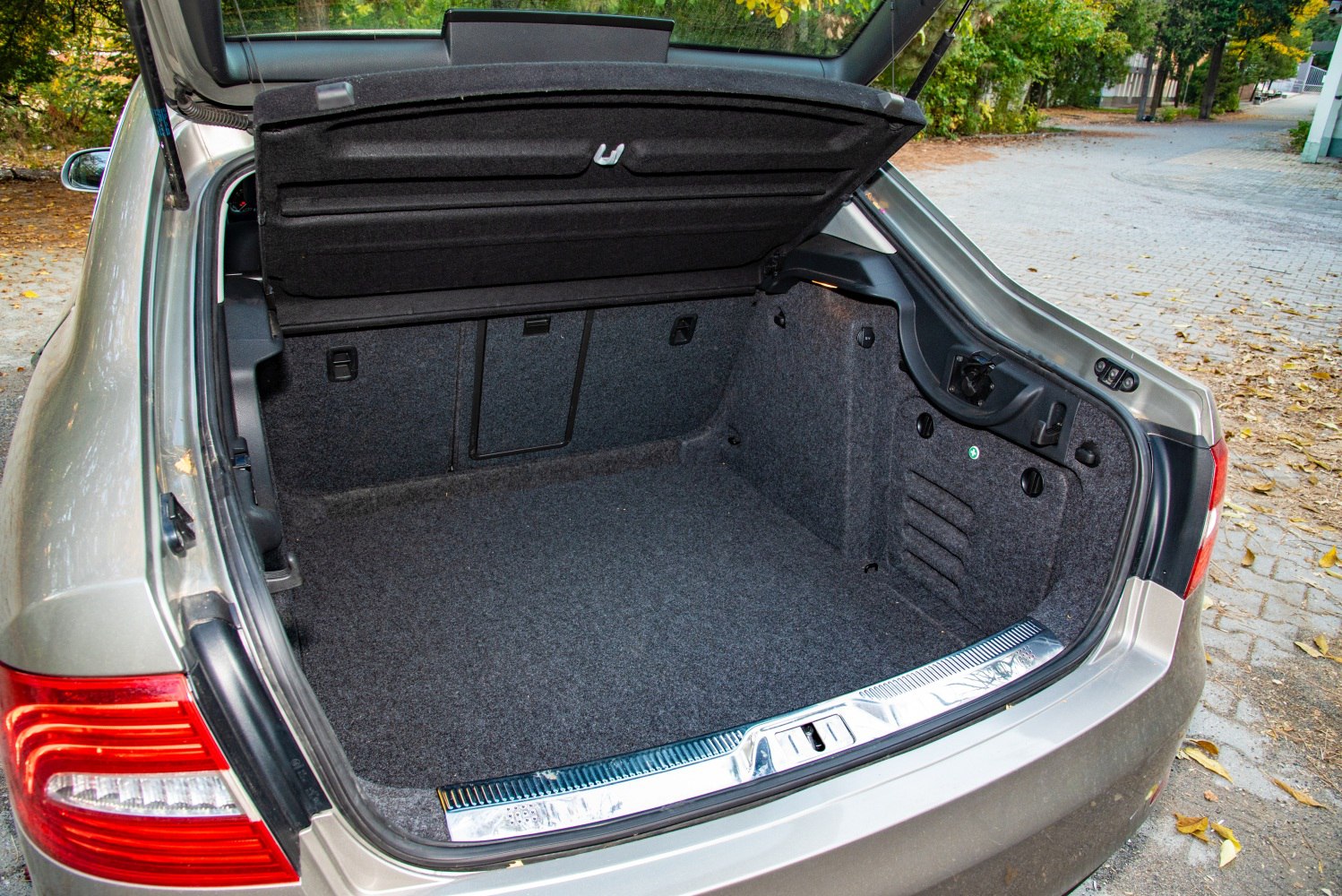 Spacious and clean car trunk interior with hatchback door open
