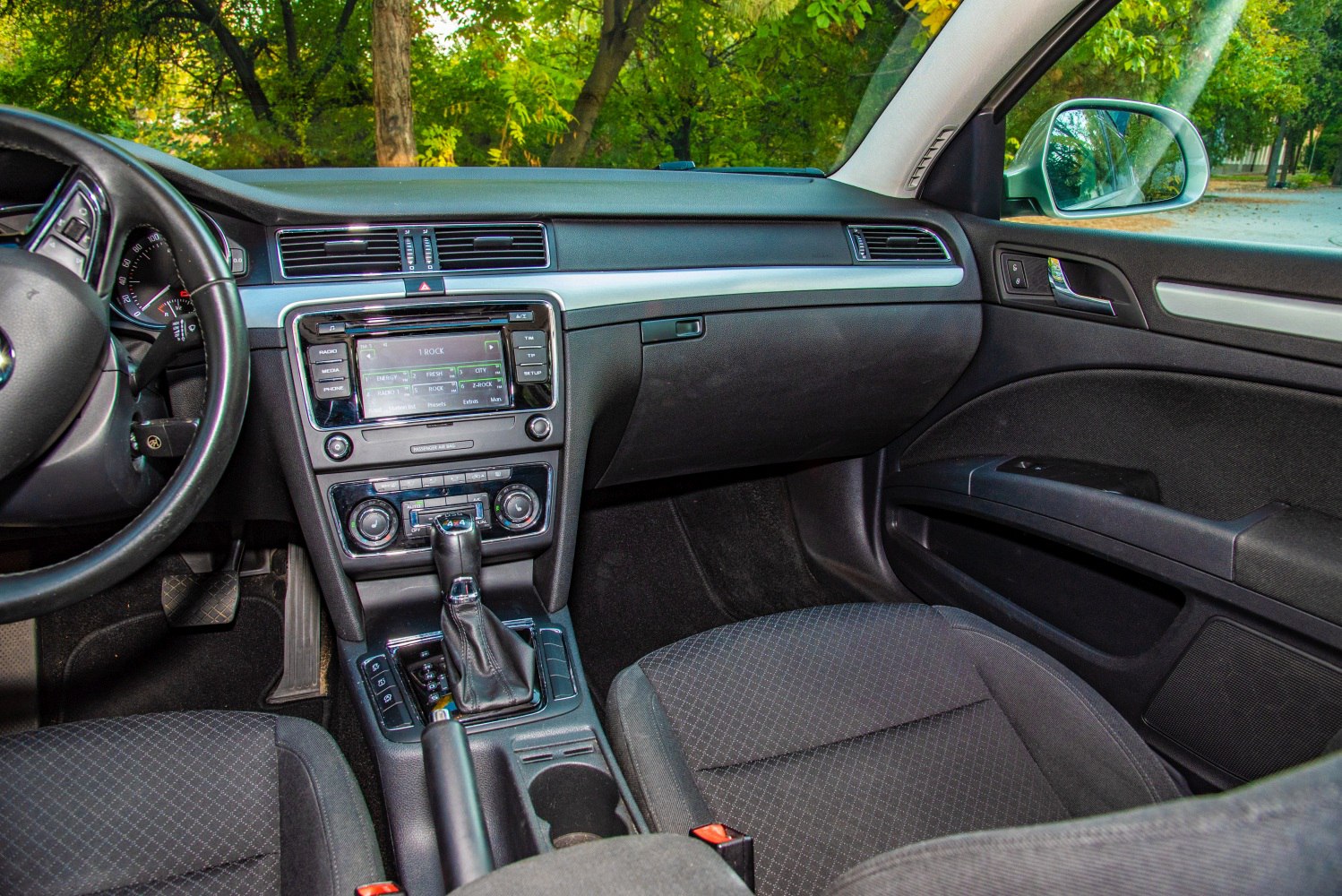 Car interior with dashboard, center console, and front seats