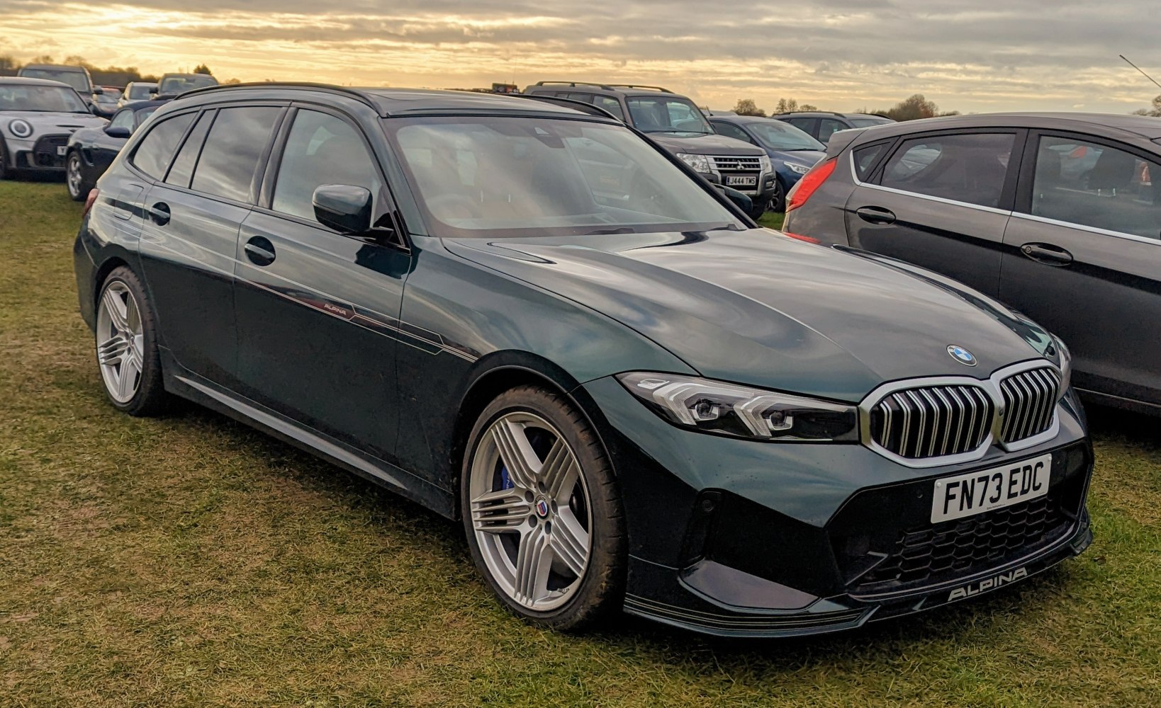 Front grille and sleek station wagon body with alloy wheels and distinctive headlights