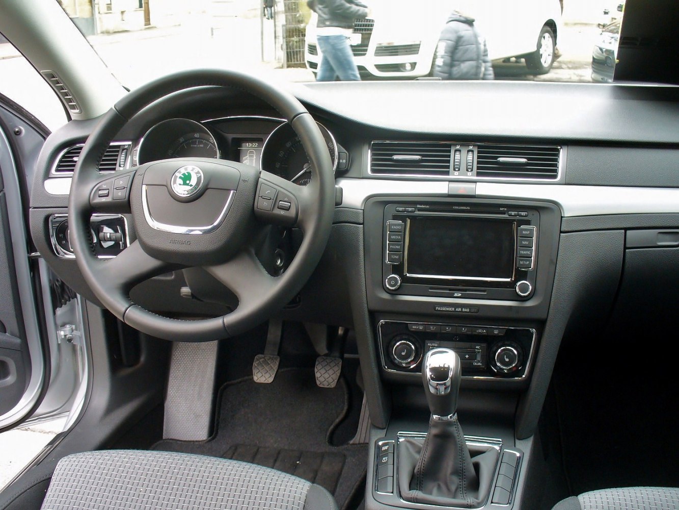 Dashboard, steering wheel, manual gear shift, and driver controls