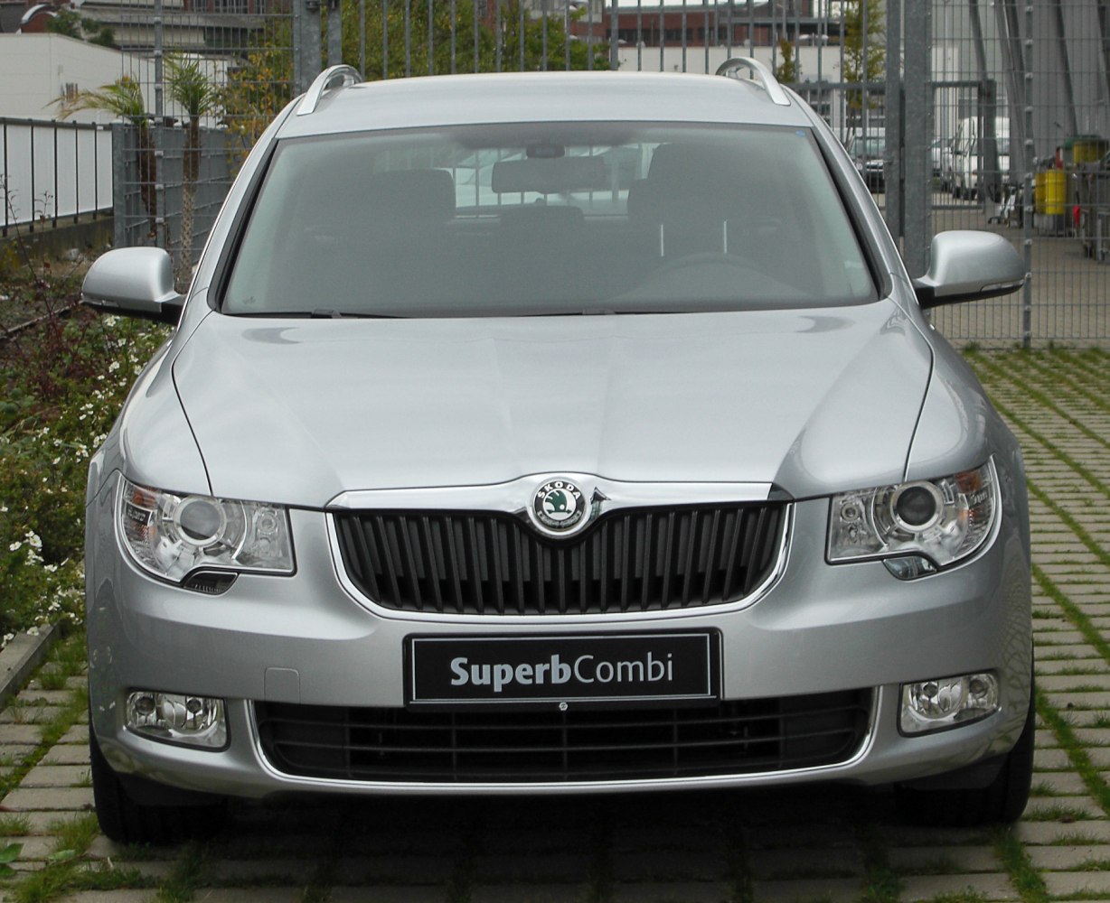 Silver front view featuring grille, headlights, and fog lights of a station wagon.