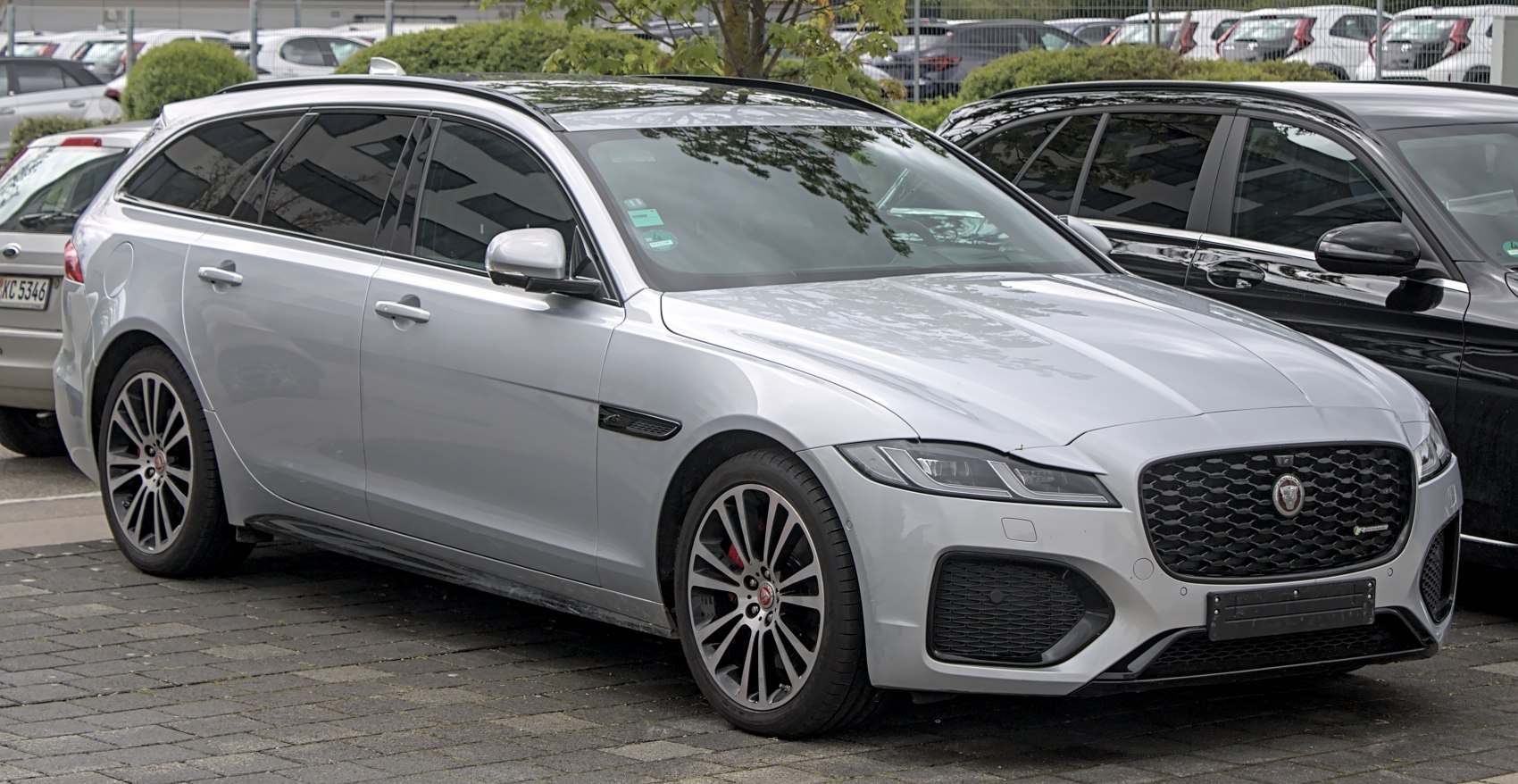 Silver station wagon with dynamic front grille and sleek alloy wheels