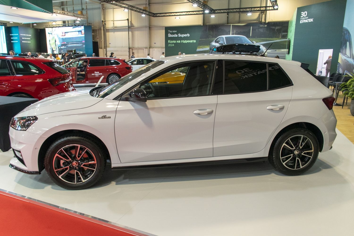 White compact hatchback side profile with alloy wheels