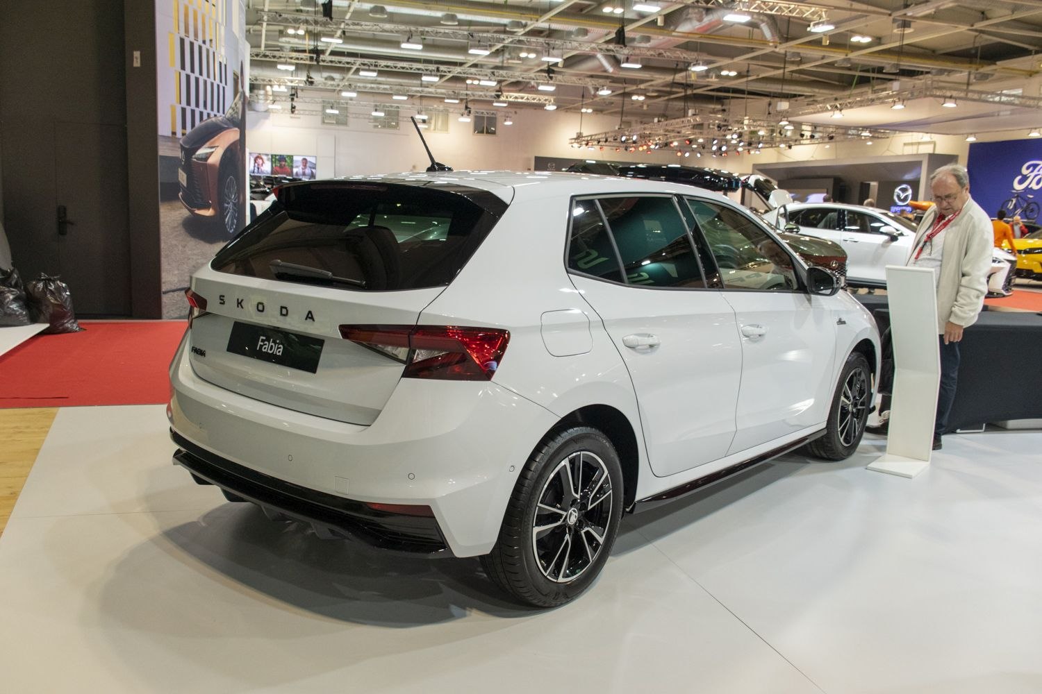 Rear view of white hatchback with modern taillights and alloy wheels