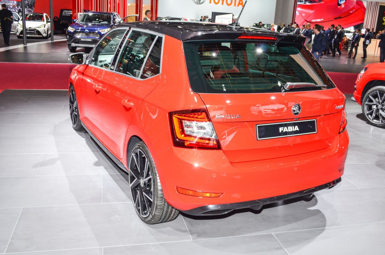 Rear hatchback view with tail lights and black alloy wheels