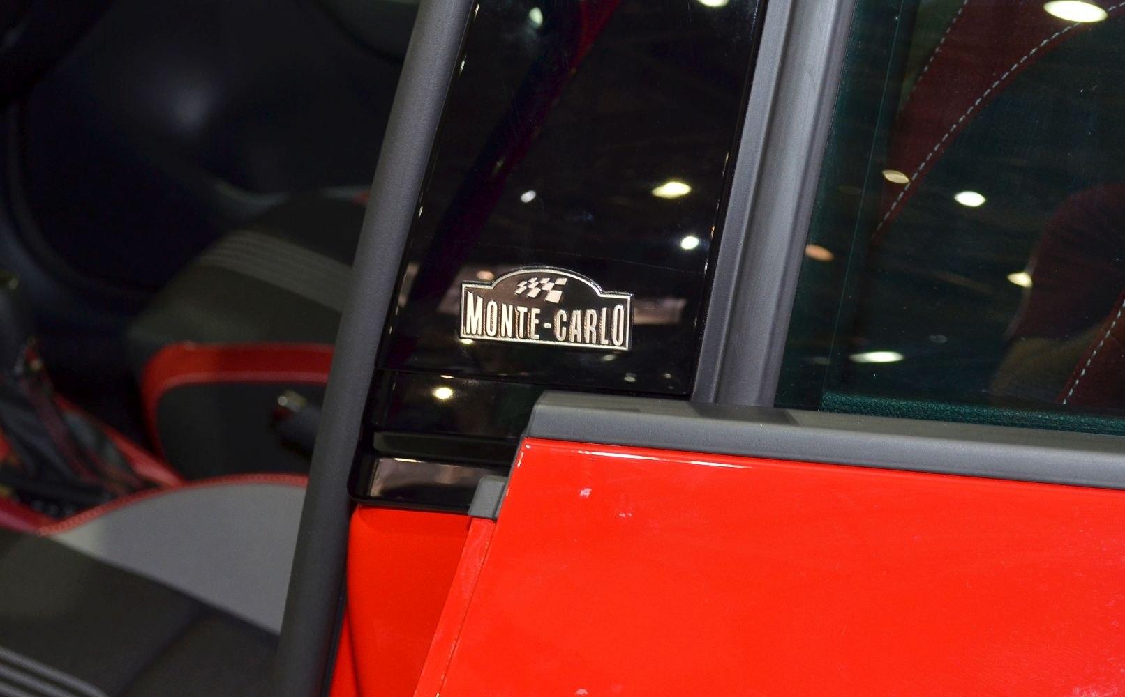 Monte Carlo edition badge on rear side window pillar and red door panel