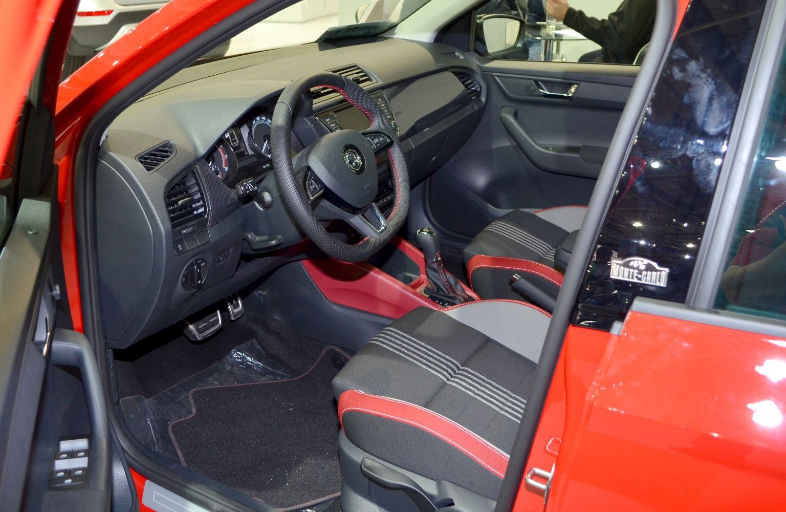 Dashboard, steering wheel, and front seats interior close-up