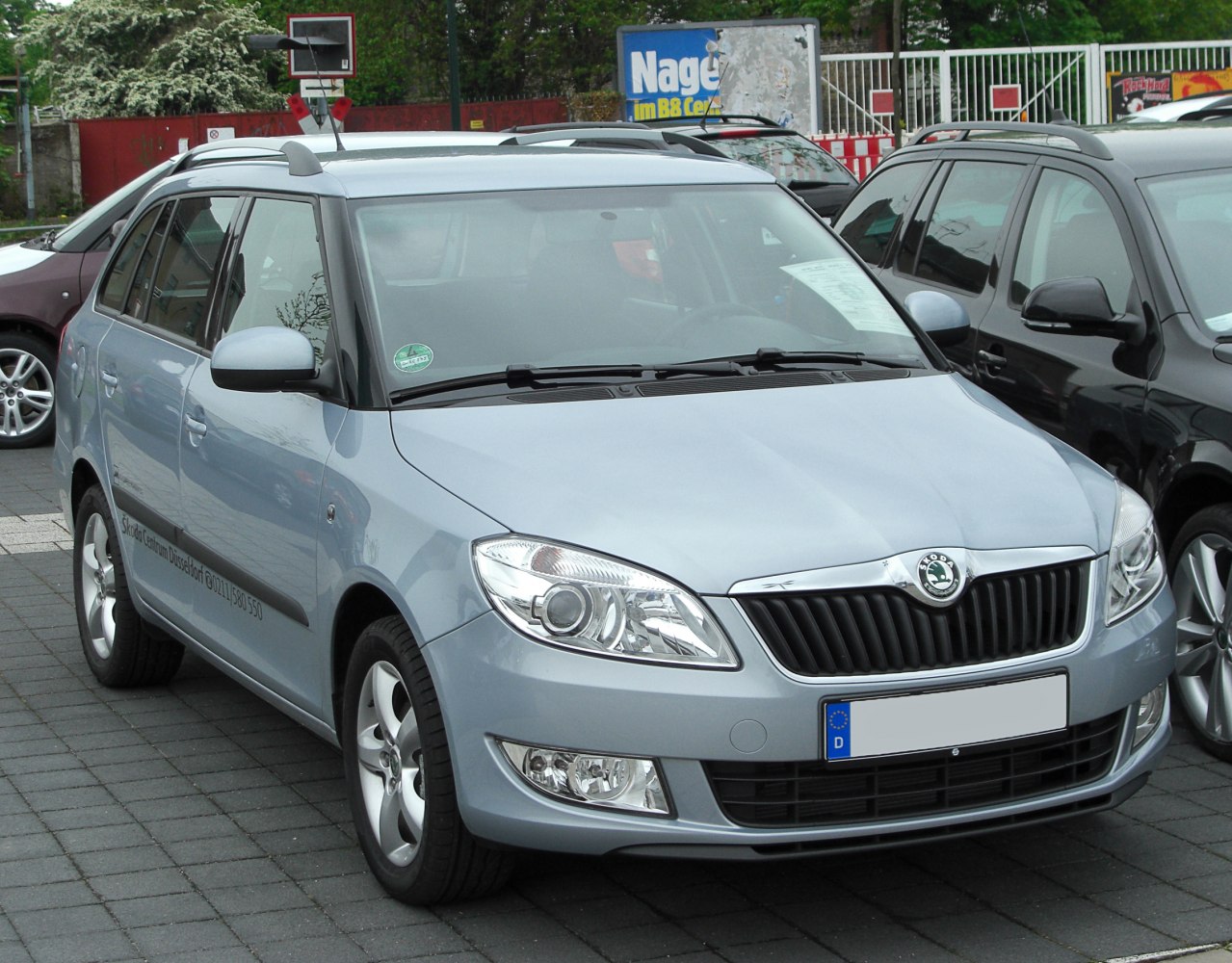 Front-side view of station wagon with roof rails and distinct headlights