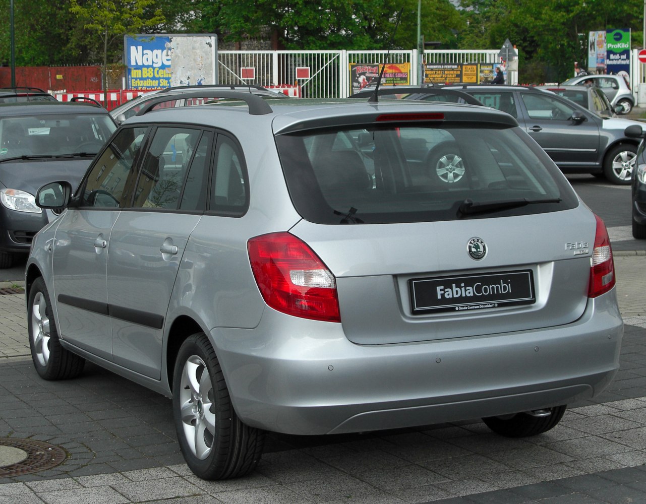 Silver compact wagon rear and side view with roof rails and tail lights