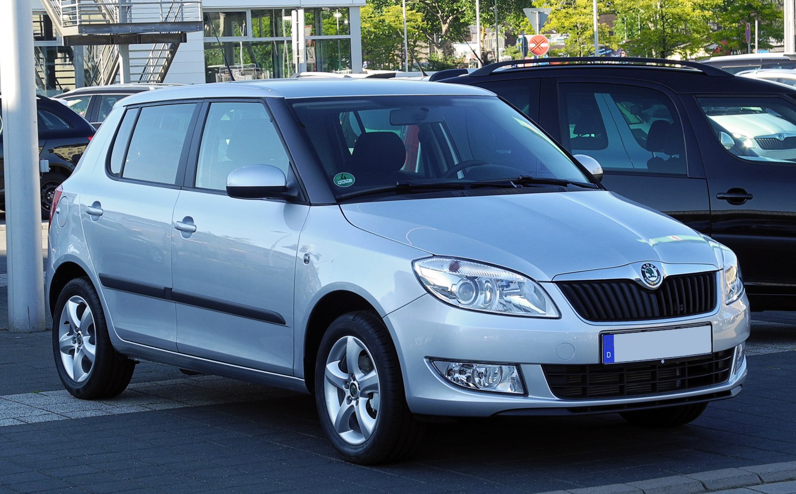 Silver compact hatchback with modern headlights and alloy wheels