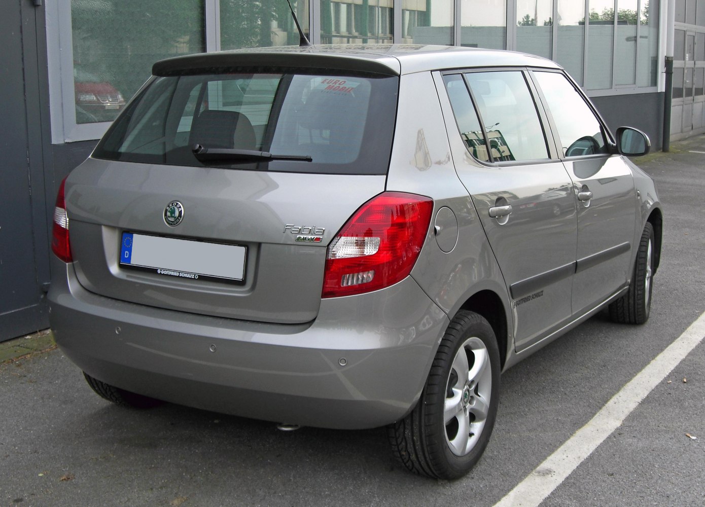 Rear view of hatchback with tail lights and alloy wheels