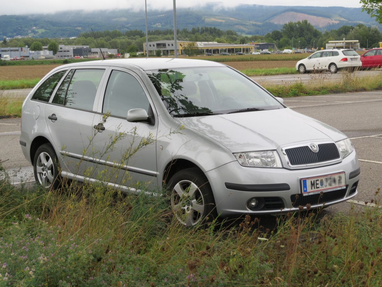 Silver station wagon with front side view and alloy wheels