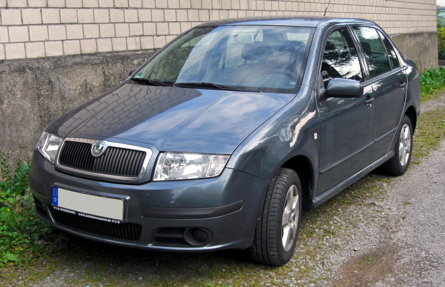 Front-side view with distinctive grille and headlights