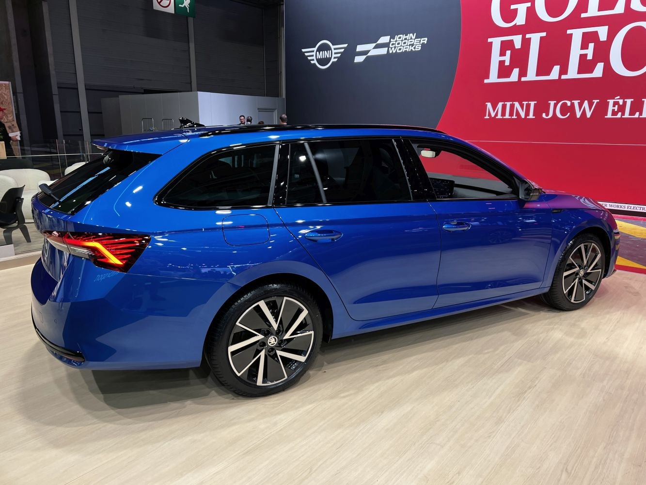Modern blue station wagon rear three-quarter view with alloy wheels