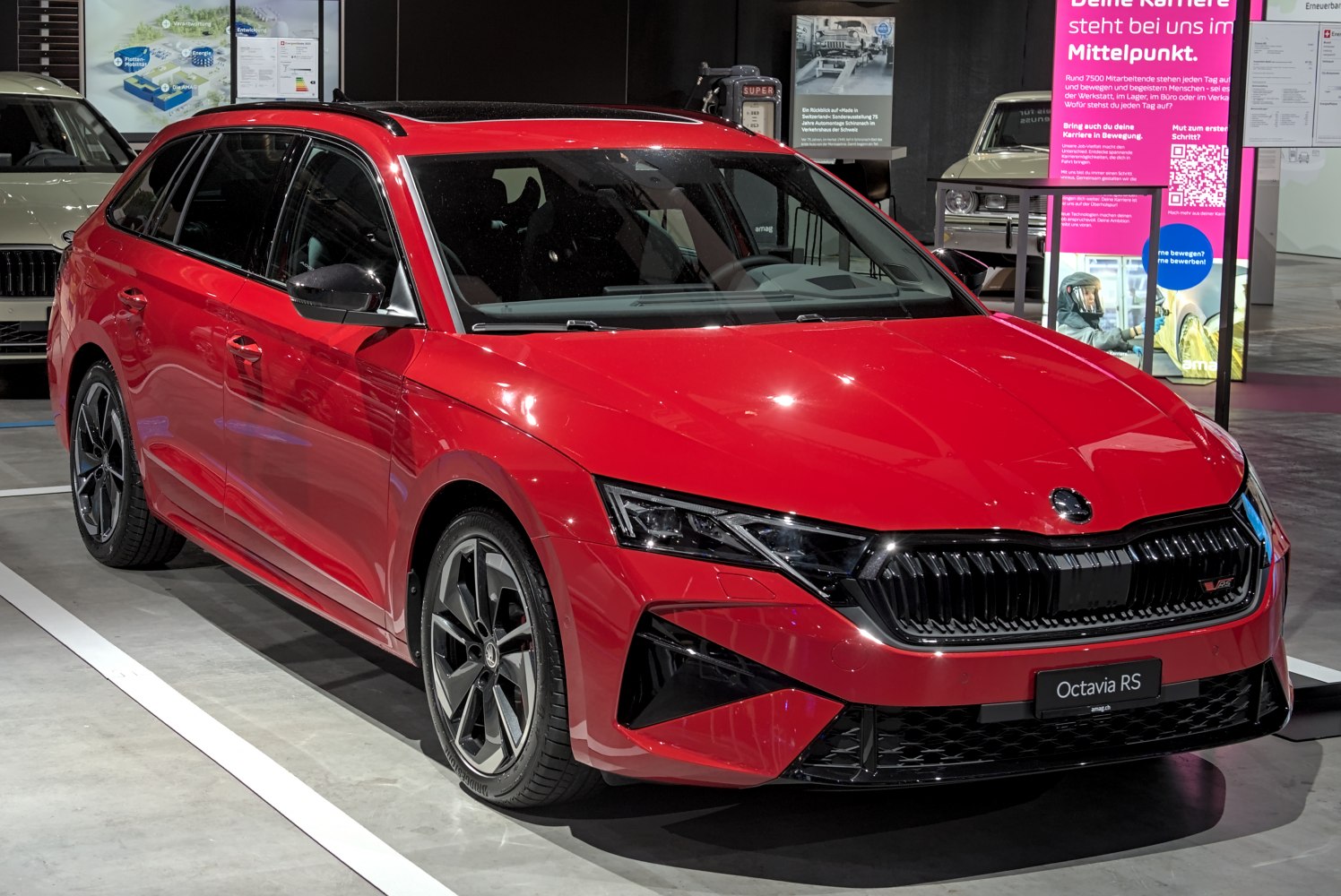 Red sporty station wagon with black grille and angular headlights