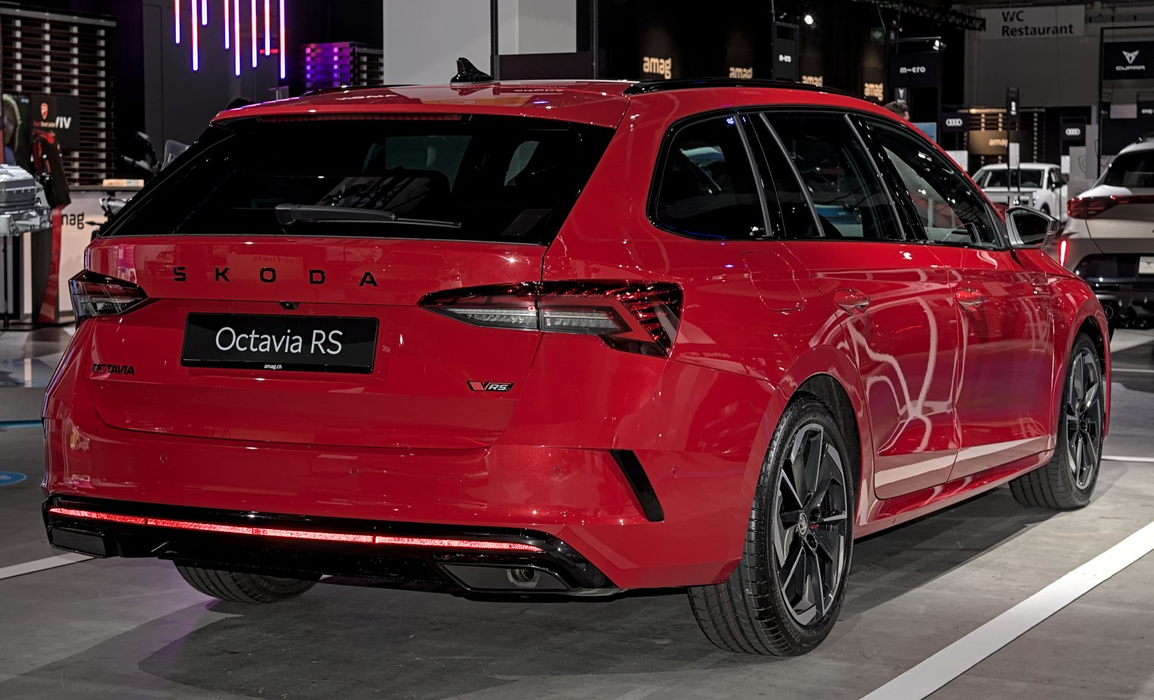 Rear view of sporty station wagon with LED tail lights and dual exhaust