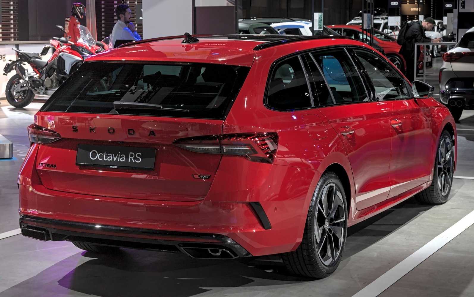 Rear view of red sporty wagon with sleek taillights and dual exhausts