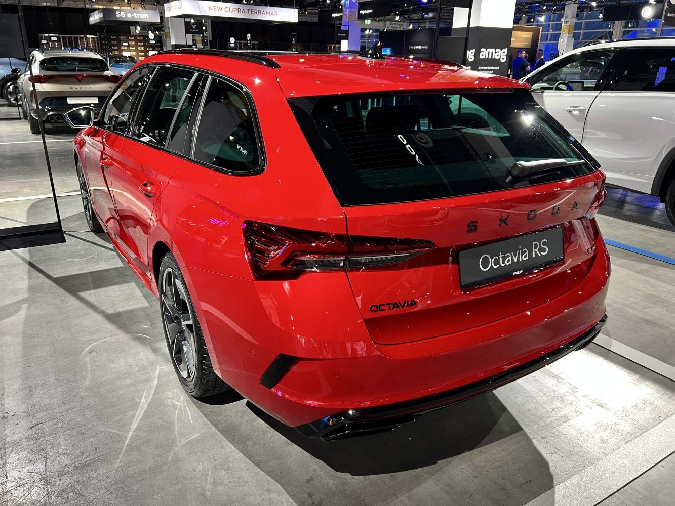 Red wagon rear and side with sporty taillights and roof rails