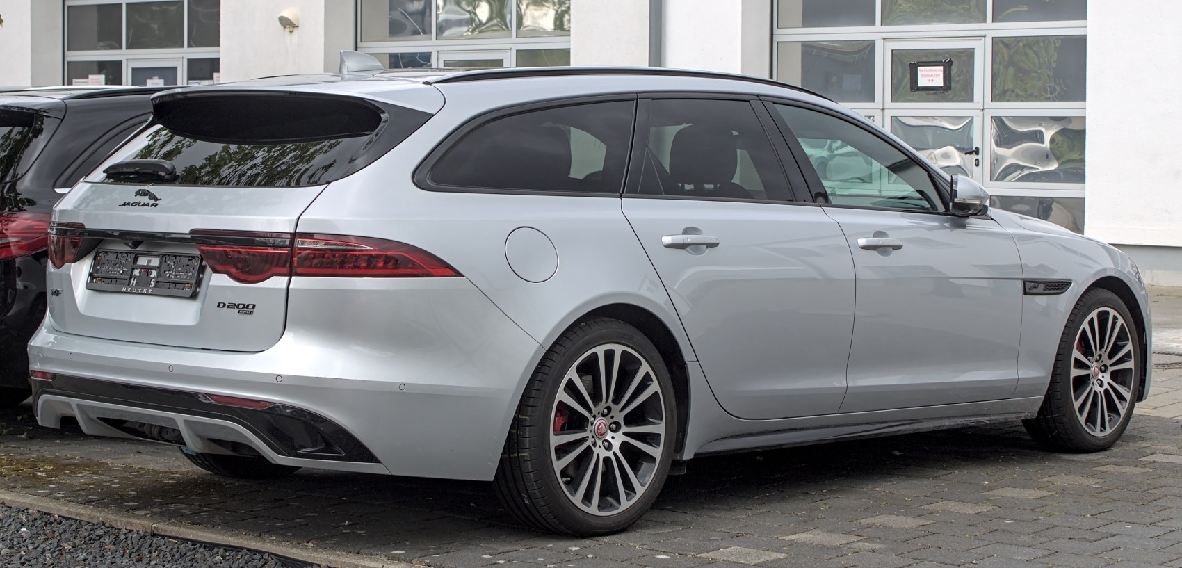 Silver station wagon rear side with sleek taillights and aerodynamic design