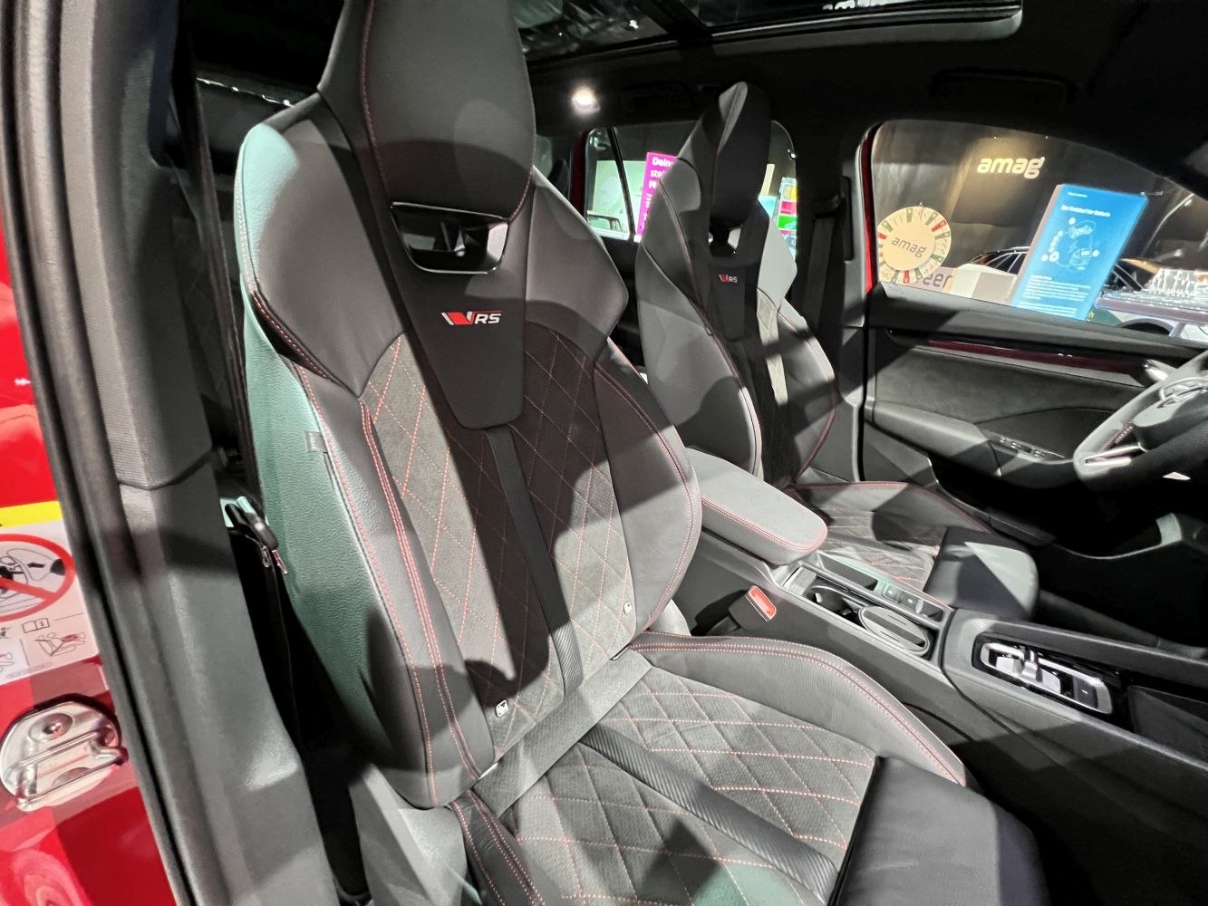 Sporty RS seats with diamond stitching and red accents