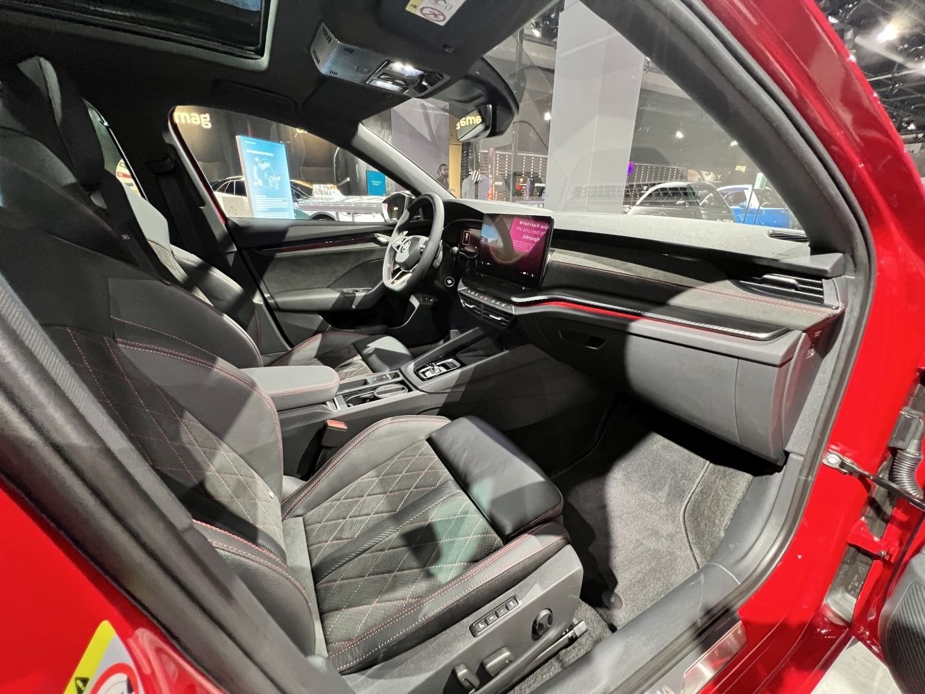 Modern car interior with quilted seats and digital dashboard display