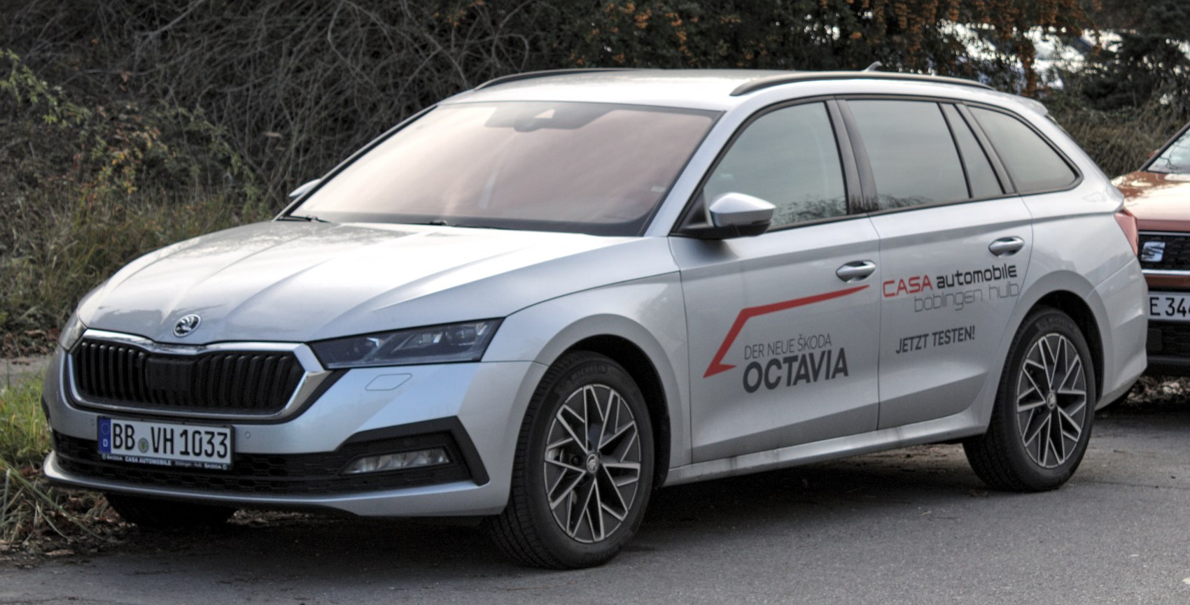 Modern station wagon with front grille, sleek headlights, and alloy wheels