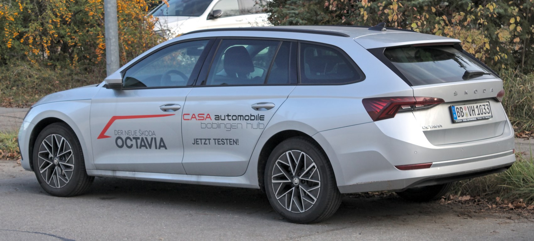 Rear and side view of station wagon with distinctive taillights and alloy wheels
